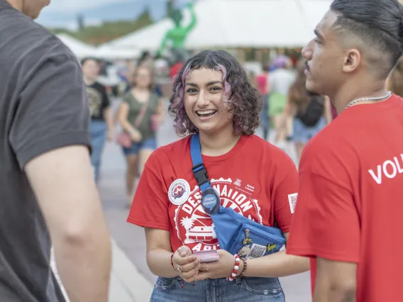 Destination Arizona Leaders, Ayleth and Hassan chat with a student during Evening Oasis.