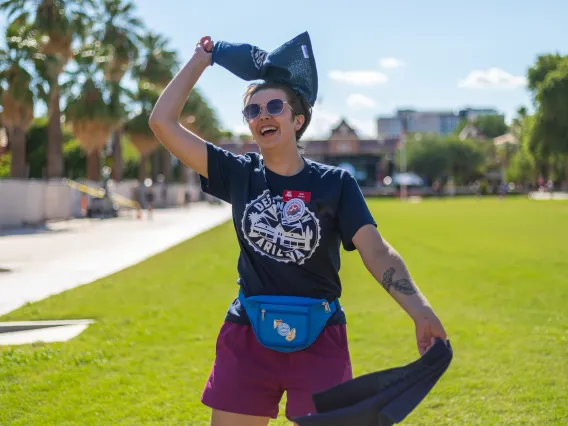 Destination Arizona Leader, Ami, waves rally towels to get students excited for Convocation. 