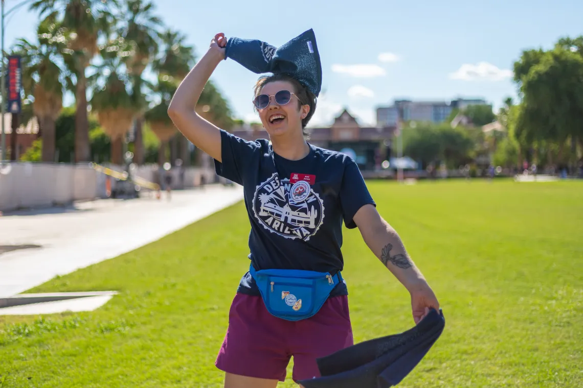 Destination Arizona Leader, Ami, waves rally towels to get students excited for Convocation. 